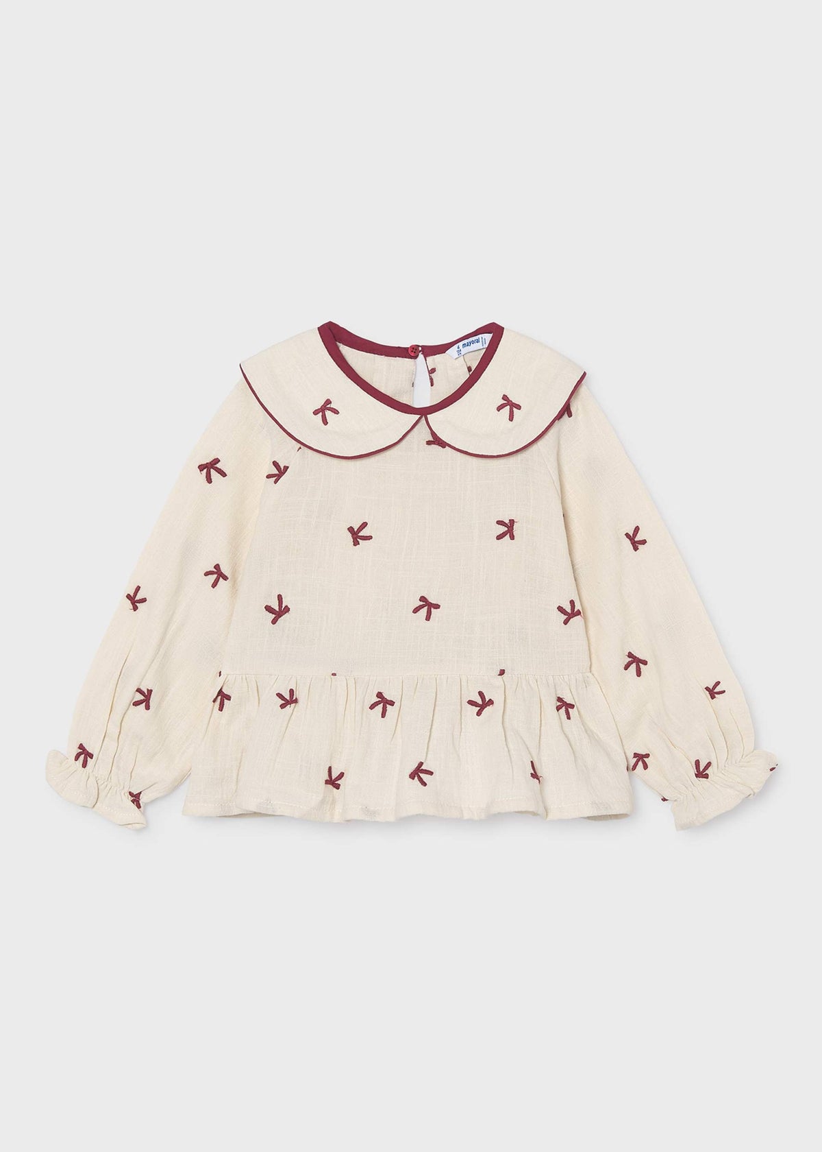Mädchenbluse mit gestickten Schleifen
